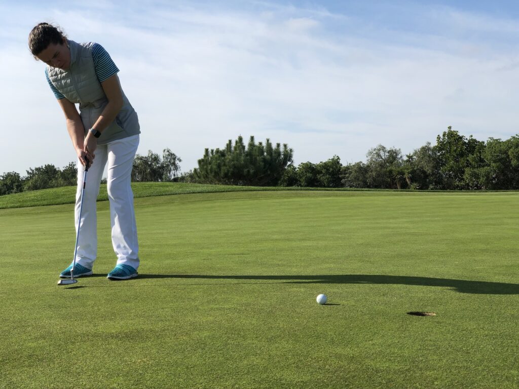 Putting on a golf putting green