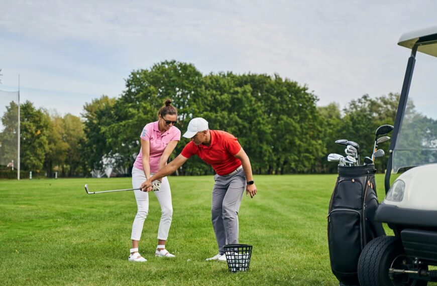 Smiling lady golfer mastering the golf basics